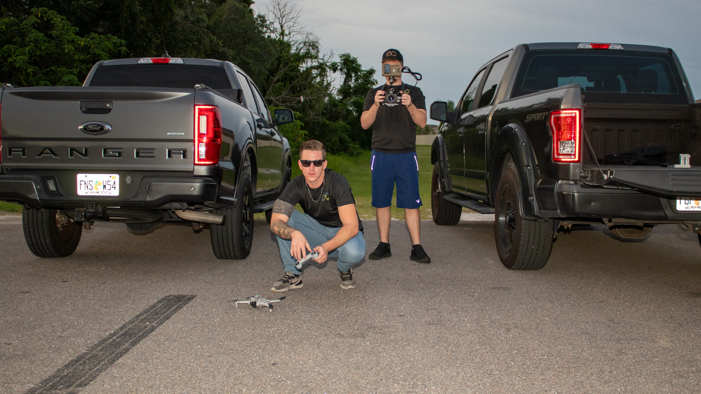 Zachary Foster (left) and Logan Foster (right) on location with drone and camera gear